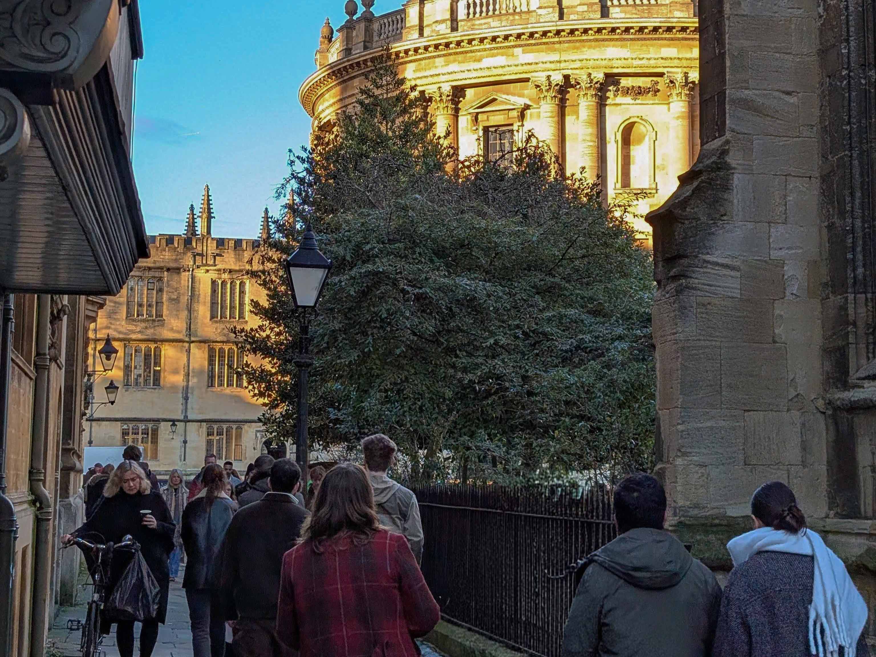 A photo of a busy Oxford city centre street, with people walking