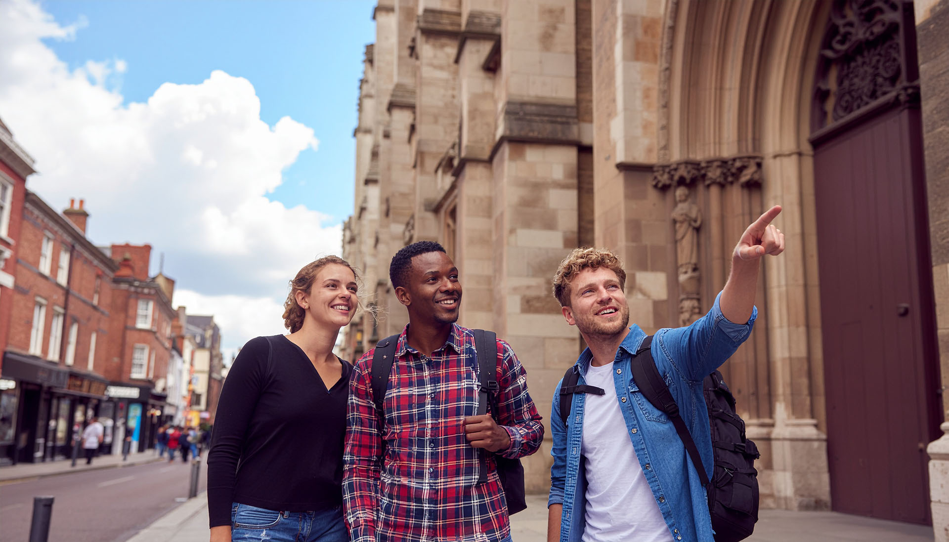 Players walking through a historic city while using the Urban Trails app.